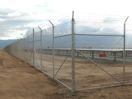 Heavy-gauge chain-link fencing protecting solar array infrastructure